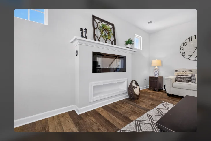 Living room fireplace with wood flooring